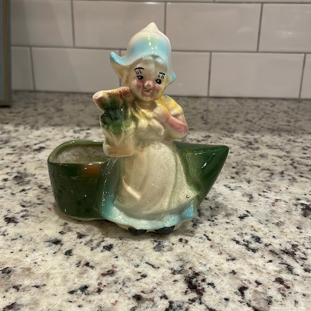 Antique. Vintage. Dutch girl planter. Green shoe.